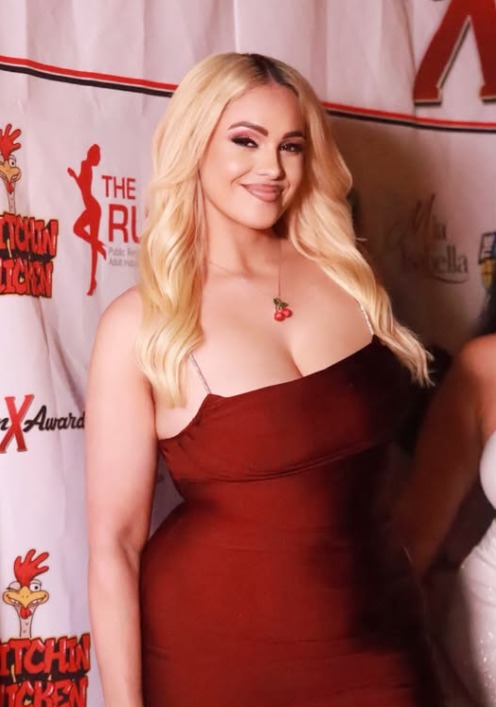 Thick blonde Puerto Rican OnlyFans model Jeyla Spice in a red dress