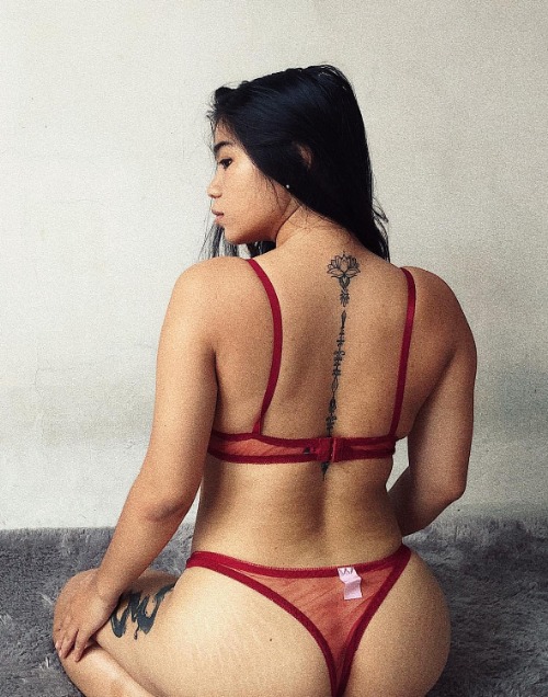 Indonesian cosplayer Badpikah in red lingerie with a lotus back tattoo